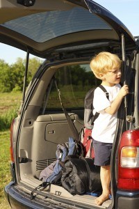 Child Waiting in Van to Leave for Vacation