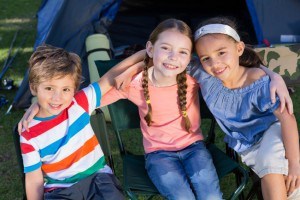 Happy siblings on a camping trip